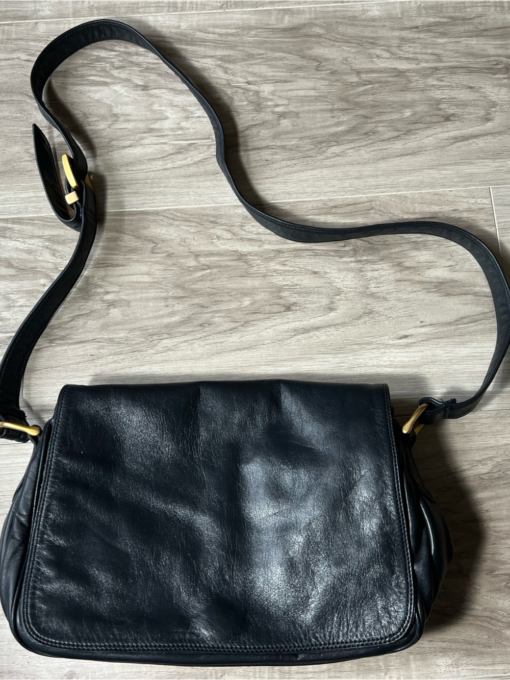 Sleek Dark Blue Leather Crossbody Bag with Gold Accents